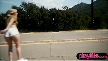 Busty petite skater MILF strips nude outdoors to flaunt big boobs